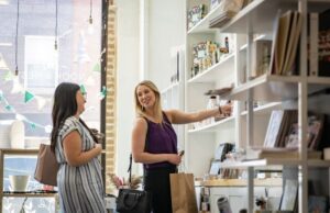 Two locals shopping at local stores in downtown Ames.